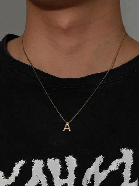 A fashionable stainless steel 14k gold plated letter necklace drop